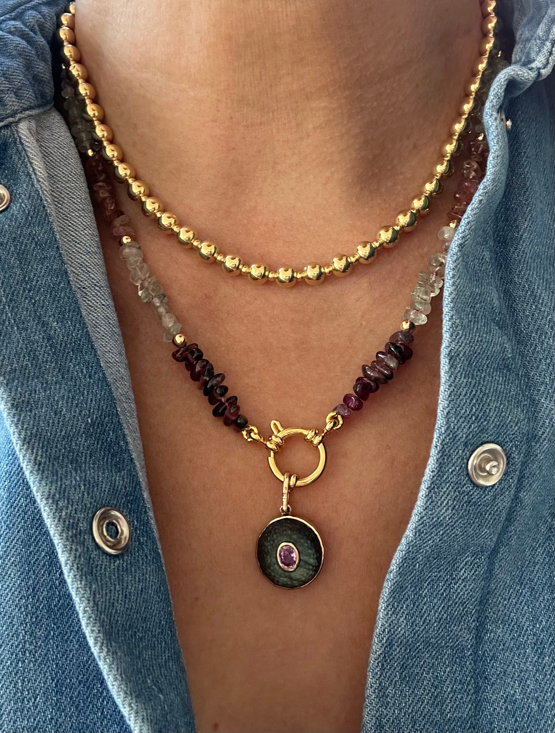 Multi-color tourmaline necklace, hand-knotted with gold-plated beads and clasp, 19.5 inches long.