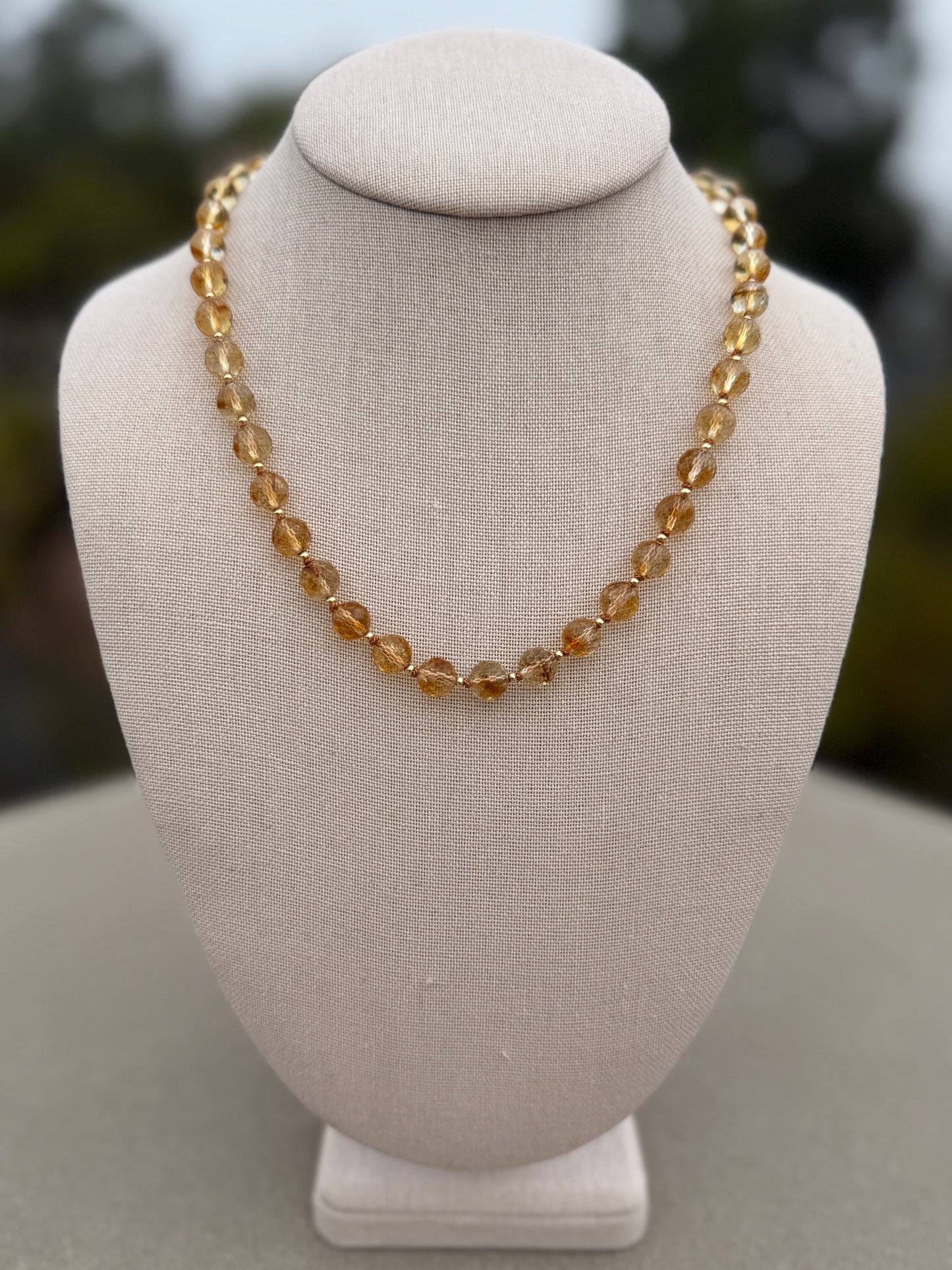 Citrine beaded necklace shown with gold chain and heart charm for styling, charm and chain not included.