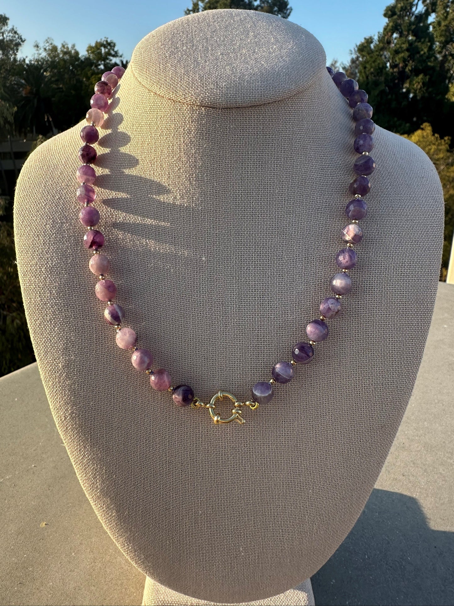 Hand-strung amethyst necklace without charms, showing bead detail and clasp